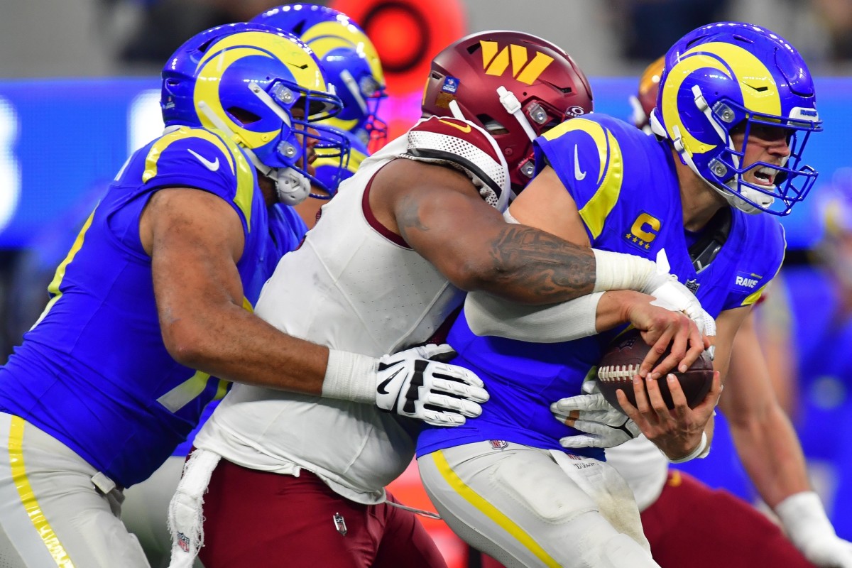 Dec 17, 2023; Inglewood, California, USA; Washington Commanders defensive tackle Daron Payne (94) brings down Los Angeles Rams quarterback Matthew Stafford (9) during the second half at SoFi Stadium.